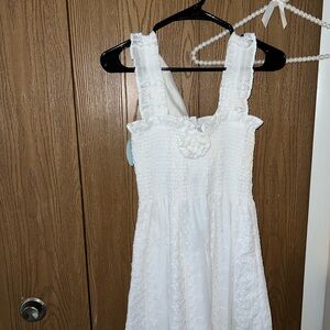White Sleeveless Dress with Floral Detail